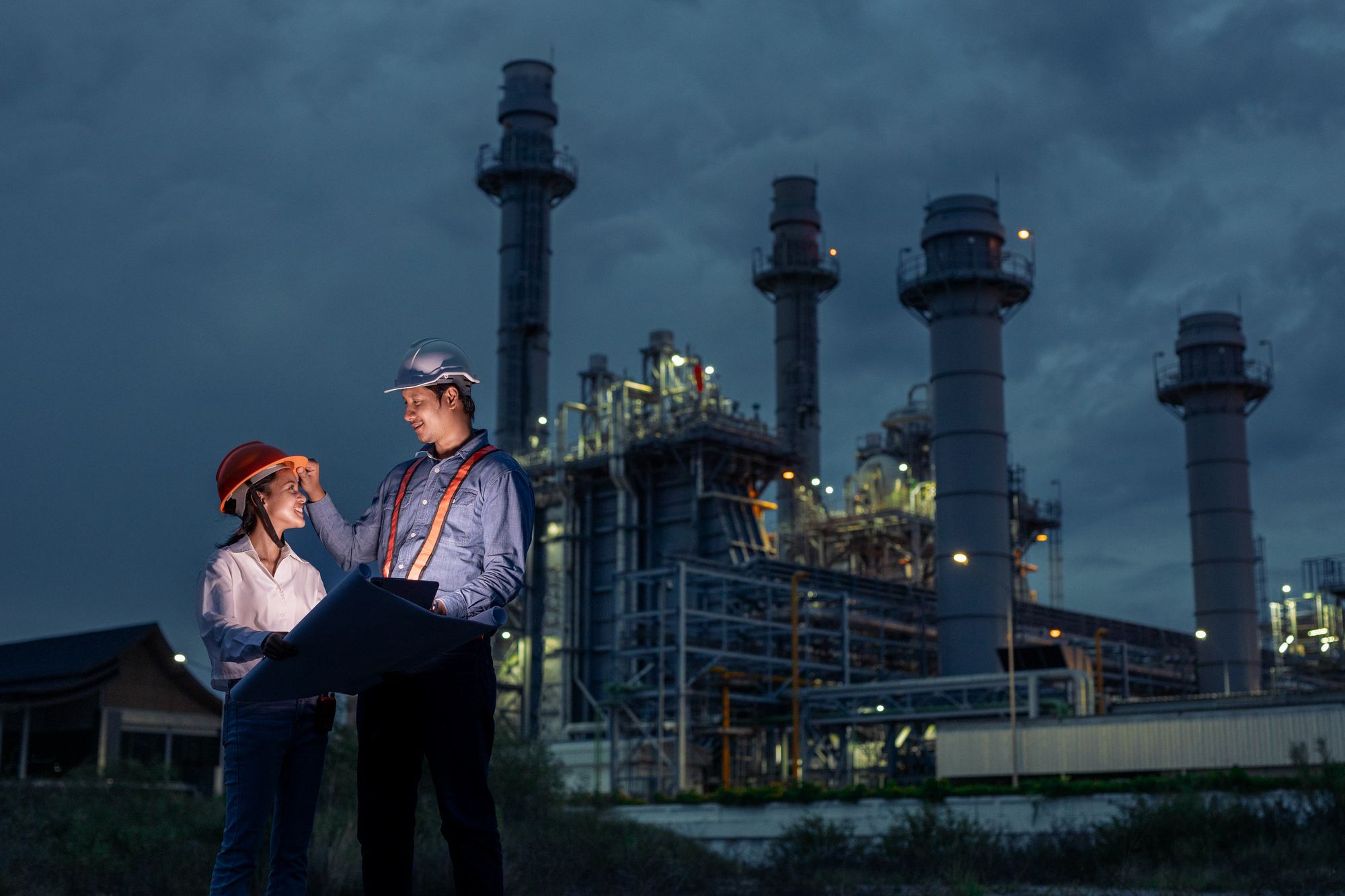 Al-Farhan Corp engineers reviewing plans at a power plant